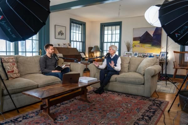 Goran, the guest of the Healthcare Reframed podcast sitting down with Judson how with a warm smile.